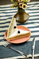 Cold Chicken sandwich With White Bread and black olive served in plate isolated on napkin side view of breakfast food photo