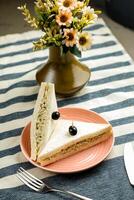 Cold Chicken sandwich With White Bread and black olive served in plate isolated on napkin side view of breakfast food photo