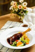 Lamb Ossobuco or Osso buco lamb shanks with potato, dip and salad served on plate isolated on napkin side view of meat food photo