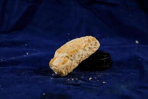 Mini Sausage Puff isolated on blue background side view of savory snack food photo