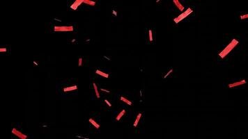 Falling shiny red confetti isolated on transparent black background. Bright festive tinsel of red color video