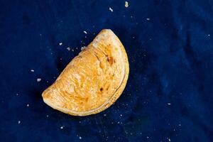 Beef Patties isolated on blue background top view of savory snack food photo