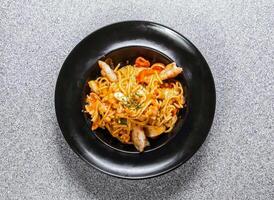 Spaghetti with Seafood in Lobster Sauce served in dish isolated on background top view of hong kong food photo