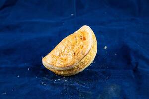 Beef Patties isolated on blue background side view of savory snack food photo