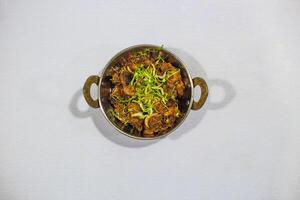 Chicken Karahi gosht korma masala served in karahi isolated on background top view of bangladeshi, indian and pakistani traditional spicy food photo