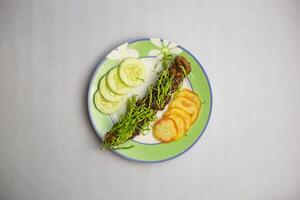 Beed Seekh kabab with tomato and cucumber served in plate isolated on background top view of bangladeshi, indian and pakistani traditional spicy food photo