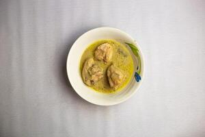 Chicken sup or yakhni served in bowl isolated on background top view of bangladeshi, indian and pakistani traditional spicy food photo