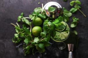 Lemon mint soda served in disposable glass isolated on table top view of healthy drink photo