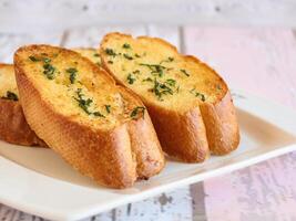 GARLIC BREAD Toast served in dish isolated wooden table top view arabic food appetizer photo