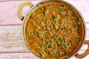 Mutton Palak Gosht Korma served in karahi isolated on table closeup top view of indian spices food photo