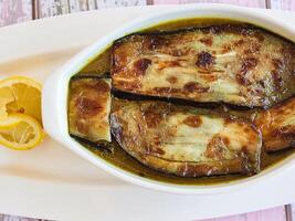 KHORESH EGGPLANT WITH LAMB served in dish isolated on table closeup top vie of arabic spicy food photo