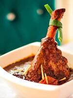 LAMB shank Tagen served in dish isolated on table closeup top vie of arabic spicy food photo