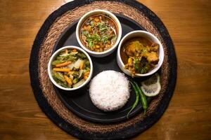 stir fry Mix Vegetables with carrot, capsicum and radish, Plain Rice, Chicken Rezala, Chonar Dal chana gosht photo