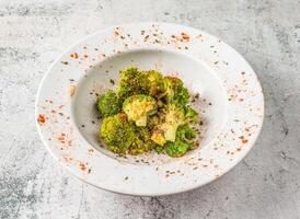 Roasted Broccoli served in isolated on grey background top view of singaporean food photo