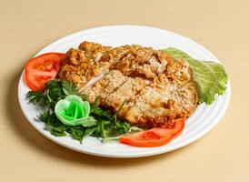 fragrant fried chicken with salad served in dish isolated on background top view singapore food photo