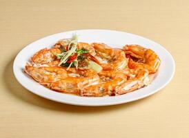 steamed prawns served in dish isolated on background top view singapore food photo