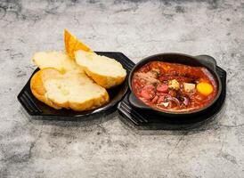 banh mi chao or pan bread served in dish isolated on grey background top view of singapore seafood photo