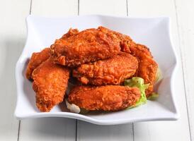 prawn paste chicken wings served in dish isolated on table top view of singapore food photo