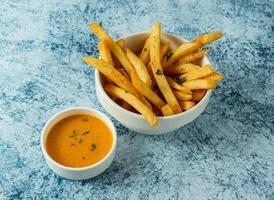 cheesy fries with cheese served in plate isolated on background top view of italian food photo