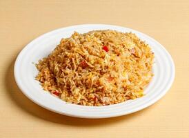 yangzhou fried rice served in dish isolated on background top view singapore foodyangzhou fried rice served in dish isolated on background top view singapore food photo