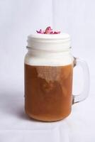 Bubble rose milk tea served in jar include chocolate and cream isolated on background side view of tea photo