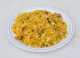 Plain biryani served in plate isolated on grey background side view of pakistani and indian spices food photo