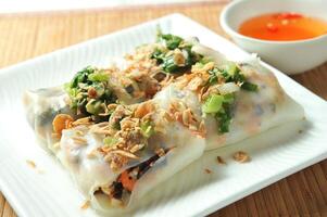 Vietnamese Steam Rolls with chilli sauce served in dish isolated of table top view fast food snacks photo