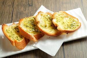 Butter Garlic French Bun bread served in dish isolated on table snack photo