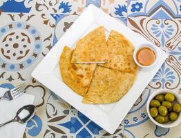 Pita Bread or paratha with Honey served in dish isolated on table top view of arabic food photo