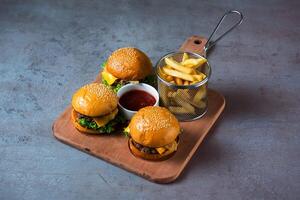 Crispy Beef Cheese slider with fries with sauce served in dish isolated on grey background top view of bahrain food photo