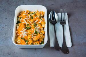 Mac and Cheetos served in dish isolated on grey background top view of bahrain food photo