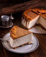 Chocolate cheesecake slice served in dish isolated on wooden table side view of arabic cafe dessert bake food photo