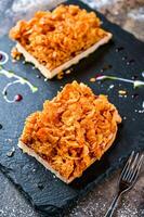 Cornflake Tart isolated on dark board top view of cafe baked food dessert photo