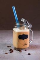 Mills Ice Shake serving in jar with straw side view on background photo