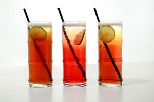 ice tea with lime slice and straw served in glass isolated on grey background side view of healthy morning arabic drink photo