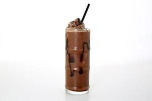 Chocolate milkshake with straw served in glass isolated on grey background side view of healthy morning arabic drink photo