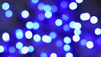 Abstract bokeh background. Moving blue shiny lights, defocused light reflections. Christmas light texture. Festive mood. Motion graphics. video