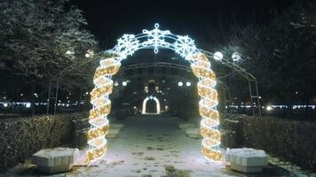 Beautiful New Year's Arch. A walk through the city at night on Christmas. New Year's mood. Immersion in Christmas. video