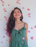 Woman With Purple Hair Standing in Front of White Wall photo