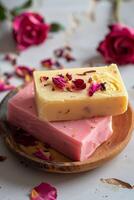 Couple of Soap Bars on Wooden Plate photo