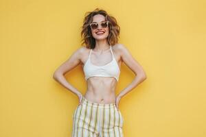 Woman in Crop Top and Striped Pants photo