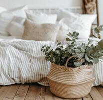 Wicker Basket With Plant on Bed photo