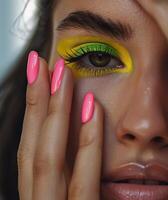 Woman With Bright Pink and Green Makeup photo