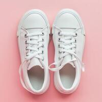 White Sneakers on Pink Background photo