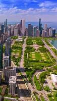 Stunning panoramic view of amazing Chicago, Illinois. Drone footage rising over the metropolis downtown. Sunny day view. Vertical video