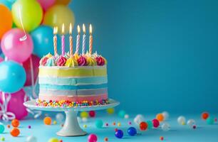 Birthday Cake With Lit Candles Surrounded by Balloons and Streamers photo