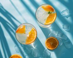 Three Glasses Filled With Orange Slices and Ice photo