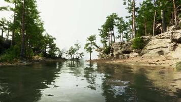 peaceful mountain oasis, with a crystal-clear lake and lush greenery video