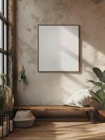 A mockup of a blank square photo frame hanging in the middle of wall with Southwestern, desert, earthy decoration.