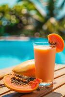 AI generated Tropical Papaya lassi and fresh papaya fruit near poolside photo